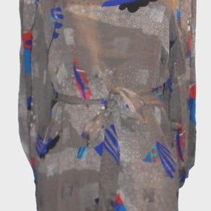 May include: A gray, long-sleeved dress with a tie belt. The dress features a pattern of blue, red, and black abstract shapes. The neckline and cuffs are trimmed with blue.