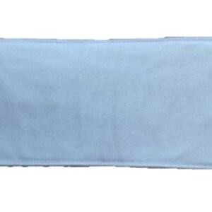 May include: A white rectangular fabric filter. The filter is made of a soft, smooth material.