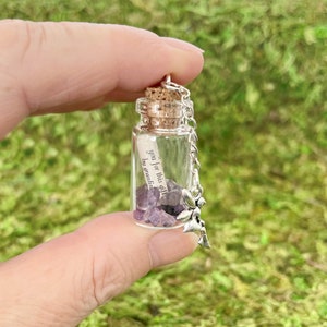 Fairy spell bottle with amethyst crystals and fairy charm