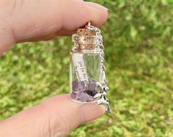 Fairy spell bottle with amethyst crystals and fairy charm