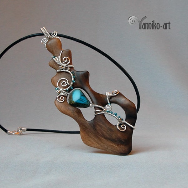 Wire wrapped wooden pendant with decorative Czech glass bead