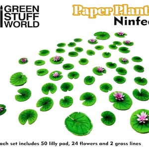 May include: A set of 50 green paper lily pads, 24 pink paper flowers, and 2 grass lines. The paper plants are arranged on a white background. The text "Paper Plants Ninfea" is in the top right corner of the image. The text "GREEN STUFF WORLD" is in the top left corner of the image. The text "*Each set includes 50 lilly pad, 24 flowers and 2 grass lines" is at the bottom of the image.