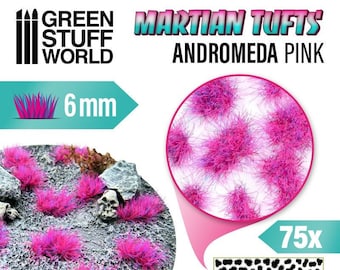 May include: A pack of 75 pink and purple 6 mm Martian Tufts for model building and miniature gaming. The tufts are shown on a base and in a close-up view. The packaging includes the Green Stuff World logo and the text "Martian Tufts Andromeda Pink".