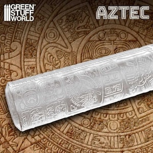 May include: A clear acrylic rolling pin with an Aztec design. The rolling pin is on top of a brown background with an Aztec design.