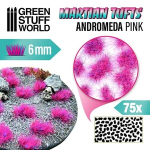 May include: A pack of 75 pink and purple 6 mm Martian Tufts for model building and miniature gaming. The tufts are shown on a base and in a close-up view. The packaging includes the Green Stuff World logo and the text "Martian Tufts Andromeda Pink".