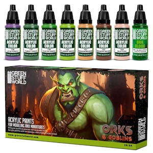 May include: A set of 9 Green Stuff World acrylic paints for modelling and miniatures. The paints are in small bottles with labels that include the colour name, number, and volume (17 ml / 0.57 fl. oz.). The set includes colours like Liche Purple, Forest Green, Hunter Green, Flubber Green, Sunbleached Bone, Redwood Brown, Pale Flesh, and Ork Blood. The set is packaged in a box with an illustration of an Orc and Goblin.