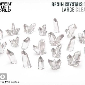 May include: A set of 20 clear resin crystals, suitable for 1/48 scale models. The crystals are various shapes and sizes, with some being long and thin, while others are more rounded and clustered.