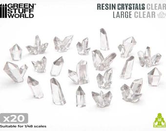 May include: A set of 20 clear resin crystals, suitable for 1/48 scale models. The crystals are various shapes and sizes, with some being long and thin, while others are more rounded and clustered.
