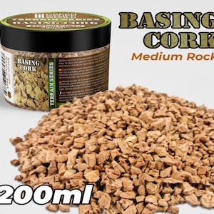 May include: A 200ml jar of cork granules for model making. The jar is labeled "Basing Cork Terrain Series Medium Rock".