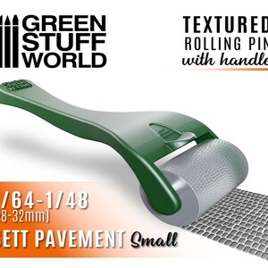 May include: Green textured rolling pin with handle for creating 1/64-1/48 (28-32mm) sett pavement.  The rolling pin is green with a gray textured roller.  The text "GREEN STUFF WORLD" is in black text on a white background.  The text "TEXTURED ROLLING PIN with handle" is in black text on a white background.  The text "1/64-1/48 (28-32mm) SETT PAVEMENT Small" is in black text on an orange background.