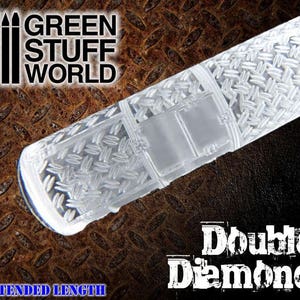 May include: A clear plastic rolling pin with a double diamond pattern. The rolling pin is designed for baking and decorating. The text "GREEN STUFF WORLD" is visible in the image. The rolling pin is labeled "Double Diamond" and "Extended Length".