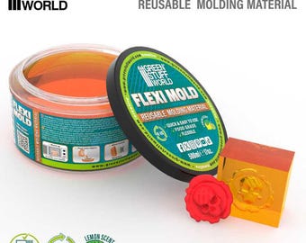 May include: A clear plastic container of orange-colored, flexible molding material with a black lid. The lid has the text "GREEN STUFF WORLD FLEXI MOLD REUSABLE MOLDING MATERIAL" printed on it. The container is labeled "500ml e 17oz.". There are three icons below the container: a glass with a fork and knife, a green circle with the word "RE-USE" in white, and a lemon with the text "LEMON SCENT".