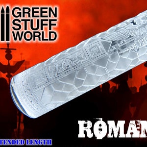 May include: A clear acrylic rolling pin with an intricate Roman-inspired design. The rolling pin is extended length and features a repeating pattern of geometric shapes and a Roman eagle. The text "ROMAN" is printed in white on a black background.