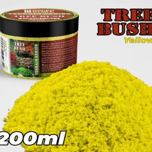 May include: A 200ml jar of yellow Tree Bush, a scenic foam for model railway. The jar has a black lid and a label with the text "Tree Bush Yellow" and "Terrain Series".