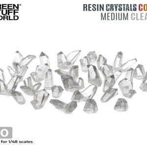 May include: A set of 30 clear resin crystals, suitable for 1/48 scale models. The crystals are scattered on a white background.  RESIN CRYSTALS COLORS MEDIUM CLEAR x30 Suitable for 1/48 scales