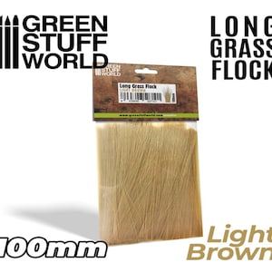May include: A package of light brown long grass flock for model railroading or other craft projects. The package is labeled "Green Stuff World" and "Long Grass Flock". The flock is 100mm long.