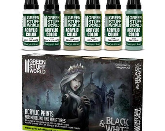 Könnte beinhalten: Ein Set Acrylfarben von Green Stuff World für Modellbau und Miniaturen. Das Set enthält sechs 17ml Flaschen Acrylfarbe in verschiedenen Farbtönen, darunter Nuclear White, Black Stallion und Grey Teal. Die Box zeigt eine Frau mit Krone und die Worte "Black & White".