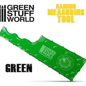 May include: Green plastic measuring tool with a ruler in inches and centimeters, a compass, and a circle with a grid pattern. The tool is labeled "Green Stuff World" and "Gaming Measuring Tool".