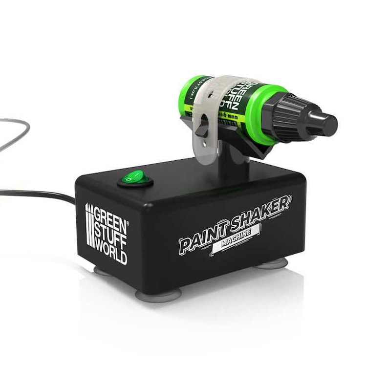 Pode incluir: M&aacute;quina de agitar tinta preta com um bot&atilde;o de ligar verde e um frasco de tinta verde e preta preso em uma bra&ccedil;adeira branca. A m&aacute;quina tem o texto "GREEN STUFF WORLD" e "PAINT SHAKER MACHINE" impresso.