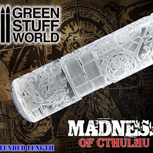 May include: A clear acrylic rolling pin with an intricate design featuring a dragon and the text "Madness of Cthulhu". The rolling pin is for use in baking and decorating.