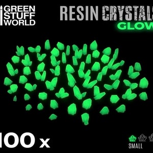 May include: 100 small green glow-in-the-dark resin crystals.  RESIN CRYSTALS GLOW.