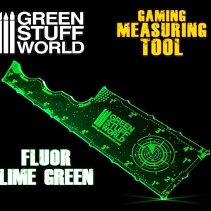 May include: A green plastic measuring tool with a ruler on one side and a circle with concentric circles on the other side. The tool is labelled "Gaming Measuring Tool" and "Green Stuff World".