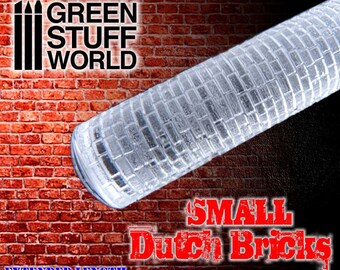 May include: A clear, cylindrical rolling pin with a textured pattern of small Dutch bricks. The rolling pin is labeled "GREEN STUFF WORLD" and "SMALL Dutch Bricks" with "EXTENDED LENGTH" text. The background is a red brick wall.