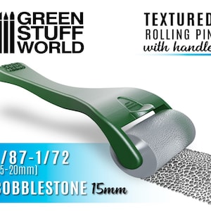 May include: Green rolling pin with a handle for creating a cobblestone texture on model surfaces. The pin is 15mm wide and is suitable for 1/87 to 1/72 scale models.