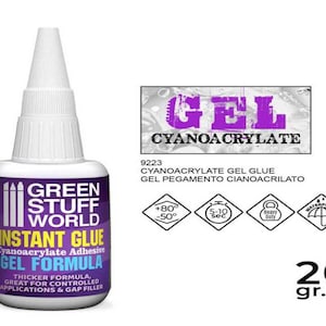 May include: A 20 gram bottle of Green Stuff World Instant Glue Cyanoacrylate Adhesive Gel Formula. The bottle is purple and white with the text "Green Stuff World Instant Glue Cyanoacrylate Adhesive Gel Formula" and "Thicker Formula, Great for Controlled Applications & Gap Filler".