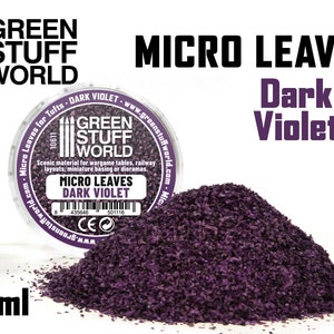 Pode incluir: Um frasco de 60 ml de microfolhas de cor violeta escura para modelagem ferroviária e bases de miniaturas. O frasco é etiquetado com "Green Stuff World" e "Micro Leaves Dark Violet".