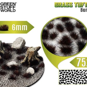 May include: A pack of 75 burnt brown 6mm grass tufts for model railroading or miniature gaming. The tufts are shown on a base with rocks and tree stumps.  The image also shows a close-up of the tufts and a pattern of how they would look when applied.