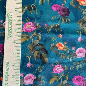 May include: Teal fabric with a floral pattern featuring pink, purple, and orange roses. The fabric is textured and has a vintage feel.