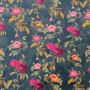 May include: A dark teal fabric with a repeating pattern of pink, red, and orange roses with green leaves.