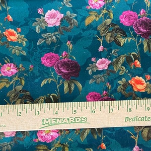 May include: Teal fabric with a floral pattern featuring pink, purple, and orange roses. The fabric is measured with a ruler that reads "MENARDS" and "Dedicated to Service".