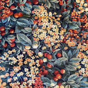 May include: A dark blue fabric with a repeating pattern of red cherries, yellow flowers, and green leaves.