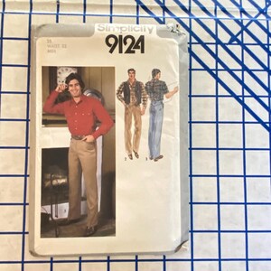 May include: A vintage Simplicity sewing pattern packet, featuring a man in a red shirt and tan pants. The packet includes illustrations of different outfit options and the number 9124. The waist size is 32 inches.
