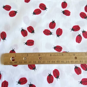 BTY Ladybug Toss Apparel Fabric Red White Cotton