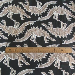 BTY Vintage Dinosaur Skeleton Fabric Black Quilting Cotton