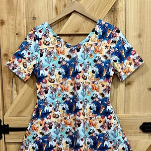 Disney cruise print tunic length top. Captain Mickey, Minnie, Pluto nautical shirt for women long top, regular and plus size side pockets