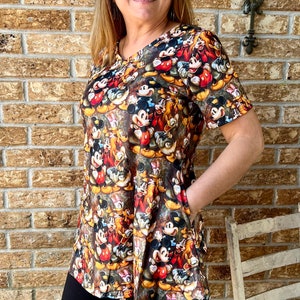 Mickey and friends vintage vibe print tunic length top. regular and plus size Side pockets