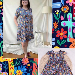 Puede incluir: Un vestido de manga corta con un colorido estampado de cruces. El vestido tiene cuello redondo y bolsillos. El fondo incluye un estampado floral y una versión más pequeña del vestido sobre una estera tejida.