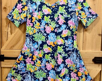 Disney print tunic length top. Tropical print top for women dark blue background. Mickey top regular and plus size side pockets