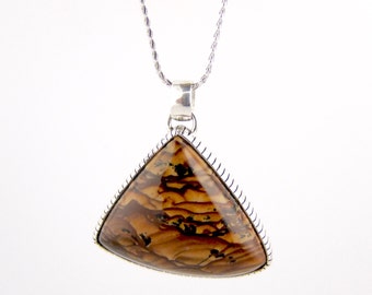 May include: A silver chain necklace with a triangular pendant featuring a brown and black patterned stone.