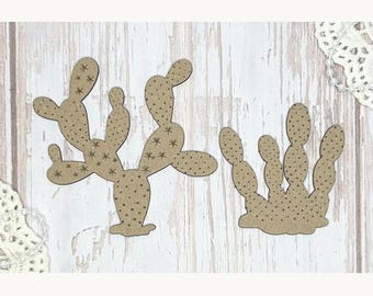 May include: Two wooden cactus cutouts. One is a tall, multi-branched cactus with star-shaped details and small brown dots. The other is a shorter, multi-stemmed cactus with similar details. Both are set against a light wood grain background.