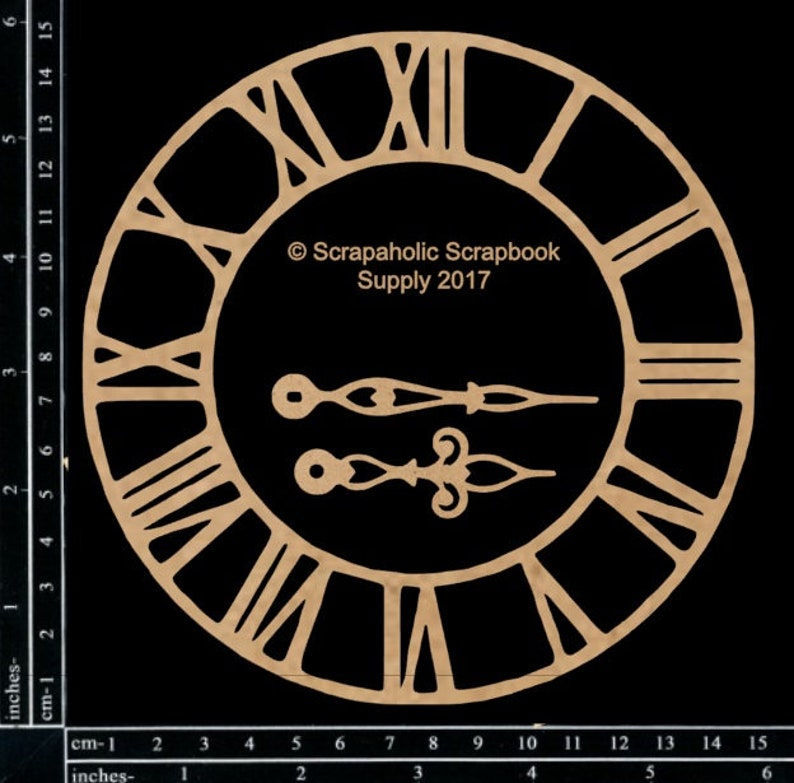 May include: A laser-cut wooden clock face with Roman numerals and two sets of hands. The clock face is circular, with the text "Scrapaholic Scrapbook Supply 2017" in the center. The clock face measures approximately 6 inches in diameter.