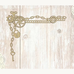 May include: A laser-cut wooden steampunk-themed corner embellishment. The design features gears, chains, a key, and a padlock. The embellishment is light brown and has a vintage, industrial aesthetic. Perfect for scrapbooking, card making, or other craft projects.