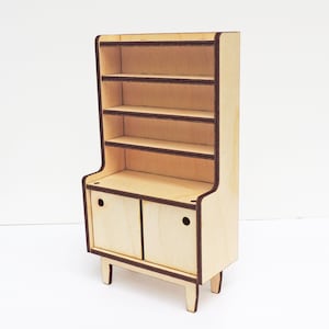 May include: A wooden hutch with a cabinet and open shelves. The hutch is made of light wood with dark brown trim. The cabinet has two doors with a small knob on each door.