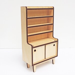 May include: A wooden cabinet with a hutch and two doors. The cabinet has four shelves and is painted in a light wood colour. The doors have a brown trim and a small hole in the centre.