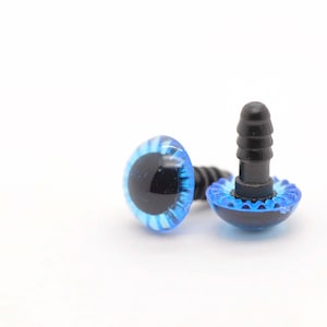 May include: Two blue plastic safety eyes with black pupils and a black plastic screw back. The eyes are for crafts and sewing.