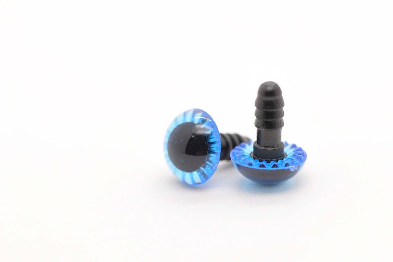 May include: Two blue plastic safety eyes with black pupils and a black plastic screw back. The eyes are for crafts and sewing.